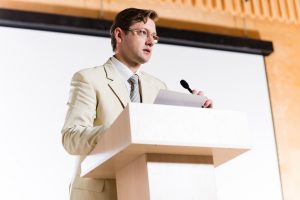Public speaker with notes