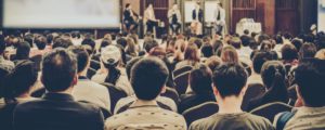 public speaker addressing audience in misuse of pronouns