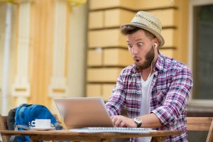 man excitedly training online on zoom call
